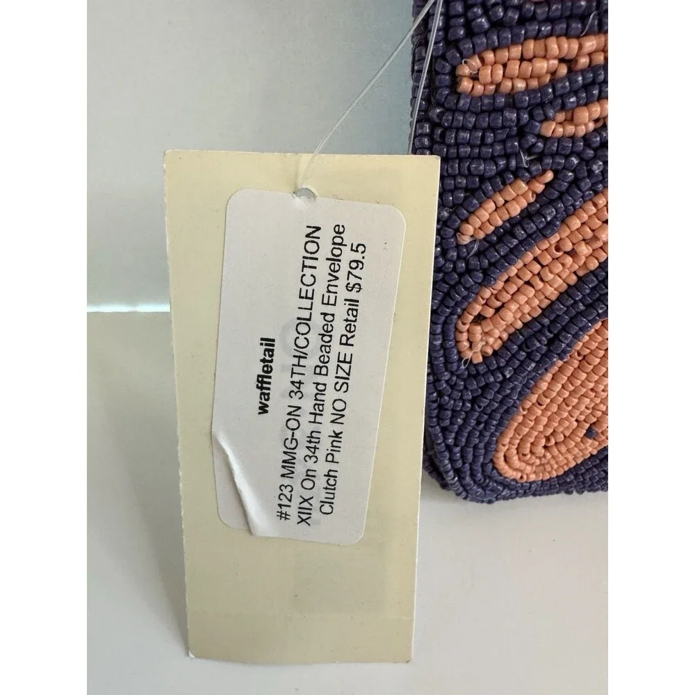 On 34th hand-beaded envelope clutch -navy and coral pink zebra stripe design